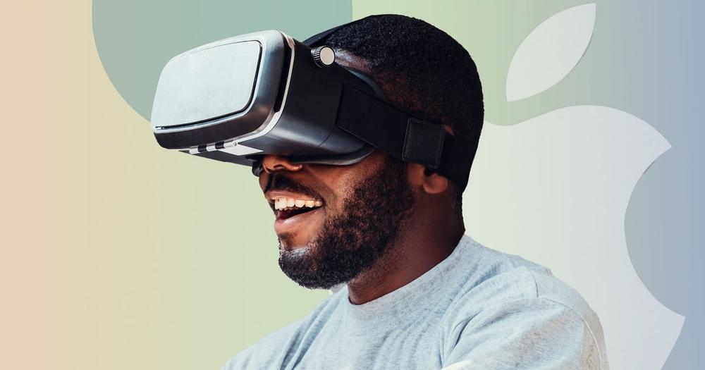 A smiling man wearing a virtual reality headset.